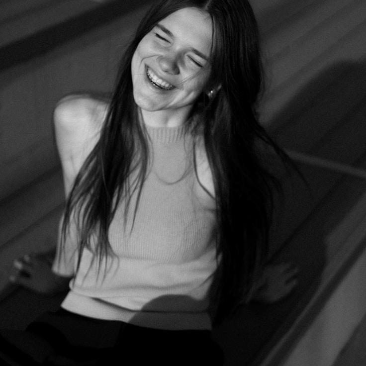 Kaveri Mehta, Lead Design Curator at Crown Orchid Petal, reviewing corporate floral arrangements